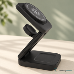 Black three-in-one foldable wireless charger showing the phone pad, watch puck and earbuds pad.