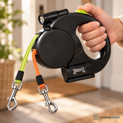 Close-up of the black dual retractable dog lead with a built-in LED light and two leash clips.