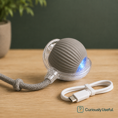 Grey rechargeable smart rolling pet ball with braided rope attachment for cats and small dogs