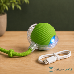 Green rechargeable smart rolling pet ball with braided rope attachment for cats and small dogs